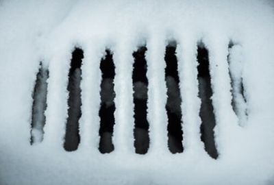 Frozen pavement drain in winter