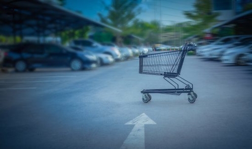 A shopping cart in a parking lot