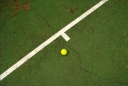 A cracked green tennis court -  It is important to know how often a tennis court needs resurfacing