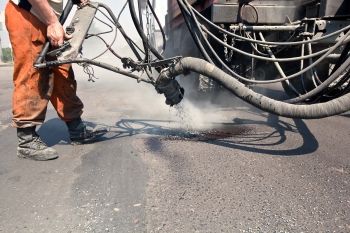 An asphalt contractor performing preventative filling