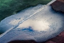 A "bird bath" damaged tennis court