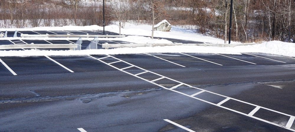 A parking lot in winter that has been sealcoated